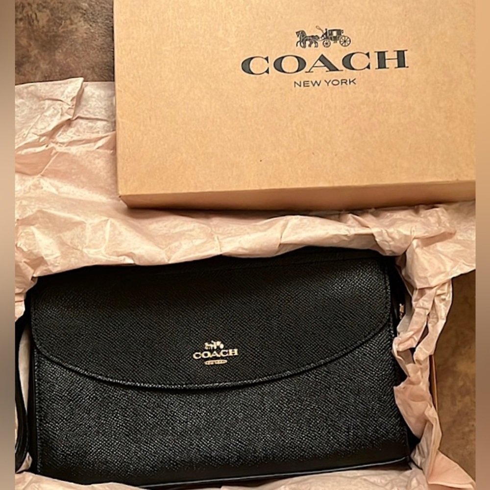 NWOT Leather Coach black clutch wristlet! Never used. Gold hardware.